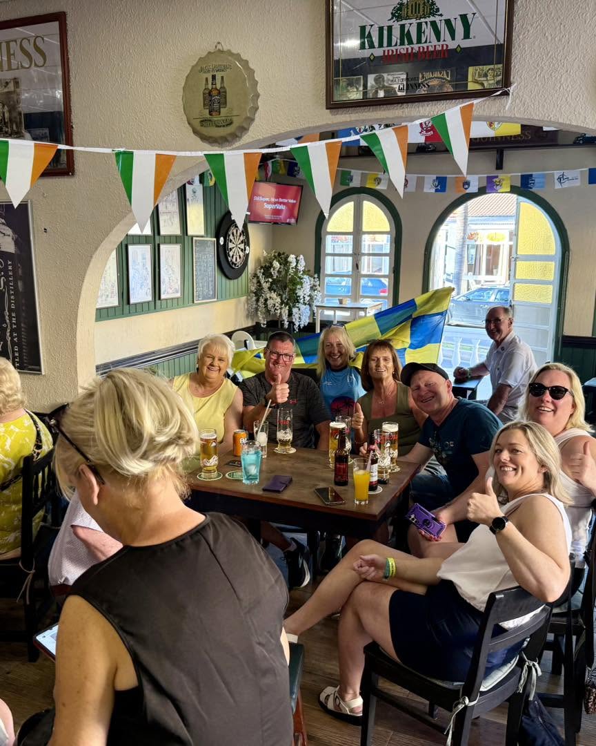 Groups enjoying drinks at the tables inside the bar